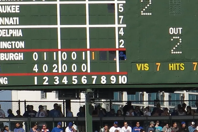 Inside the hand-operated scoreboard at Wrigley Field, where numbers are changed by hand