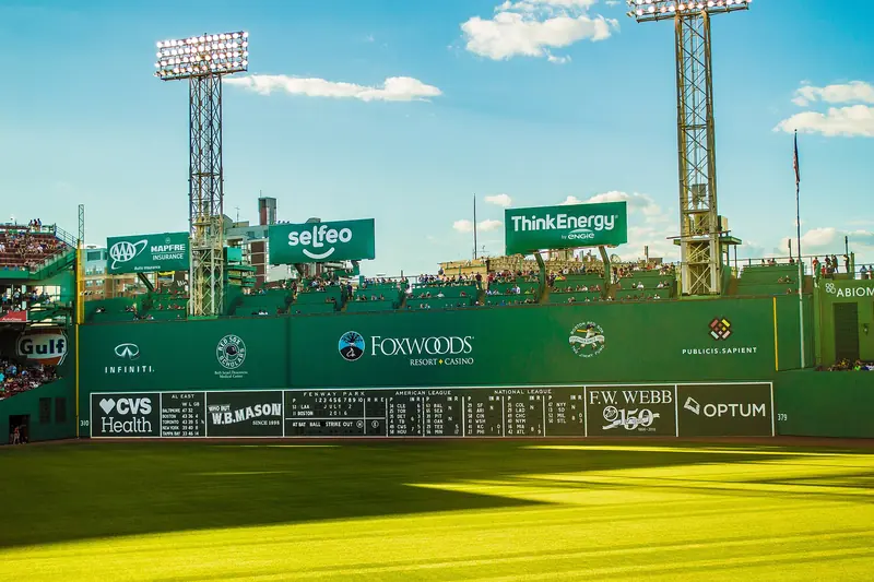 The manual scoreboard on the Green Monster wall at Fenway Park