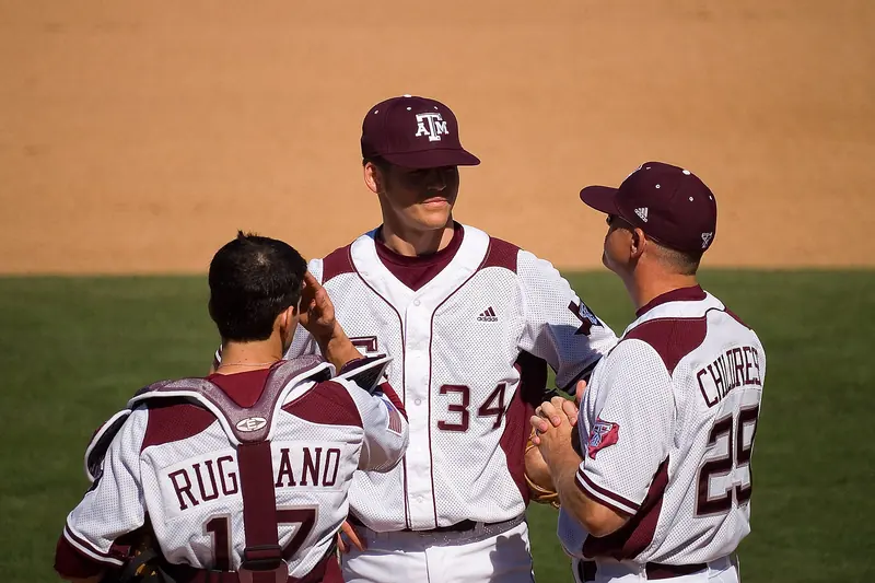 Players and coaches meet on the mound during a game